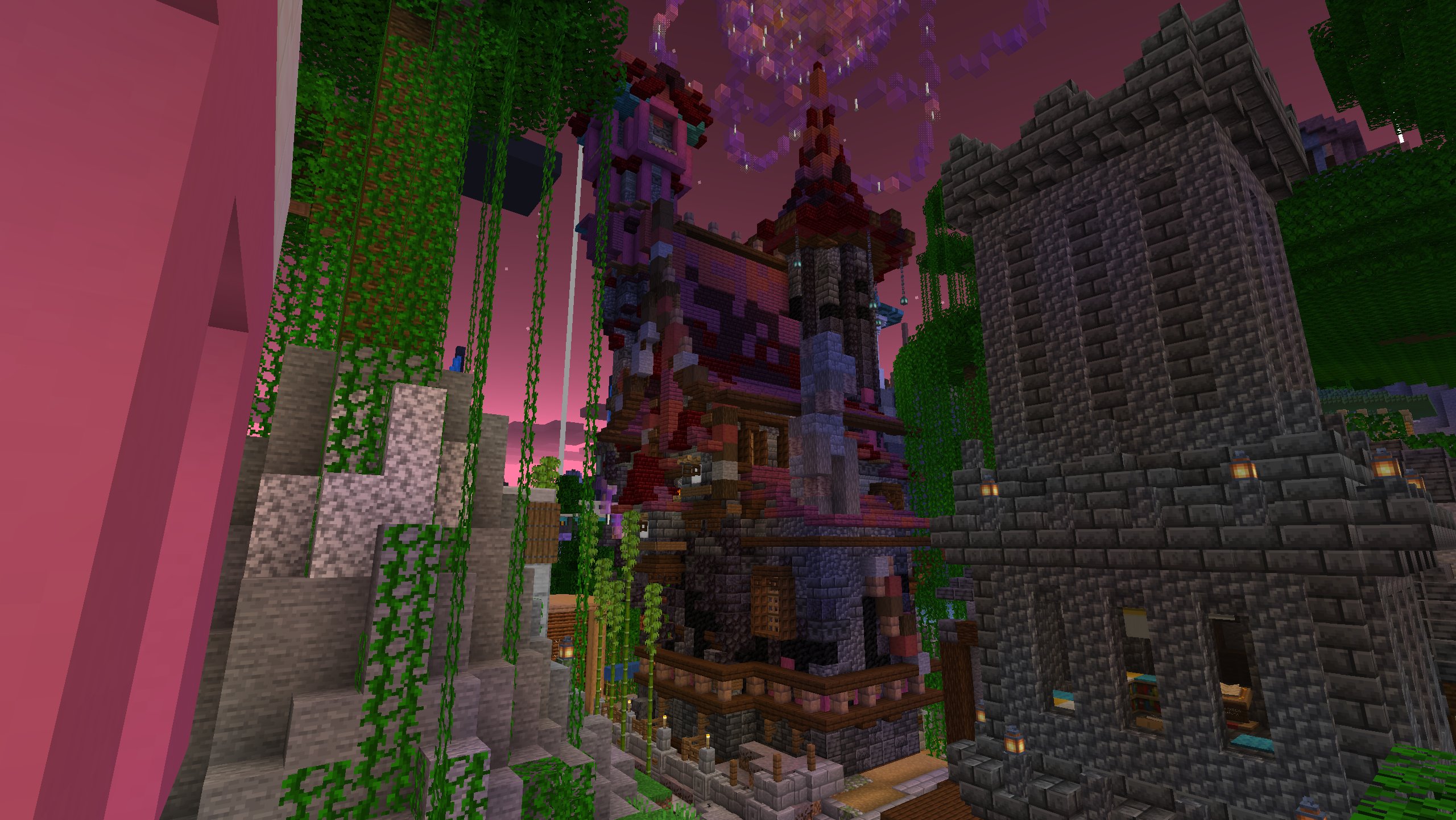 A tall red-and-purple pagoda-style player house rising between stone towers under a vivid pink sky, draped in vines.